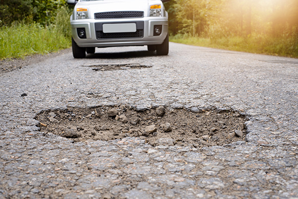 What to Do When You Hit a Big Pothole On The Road?